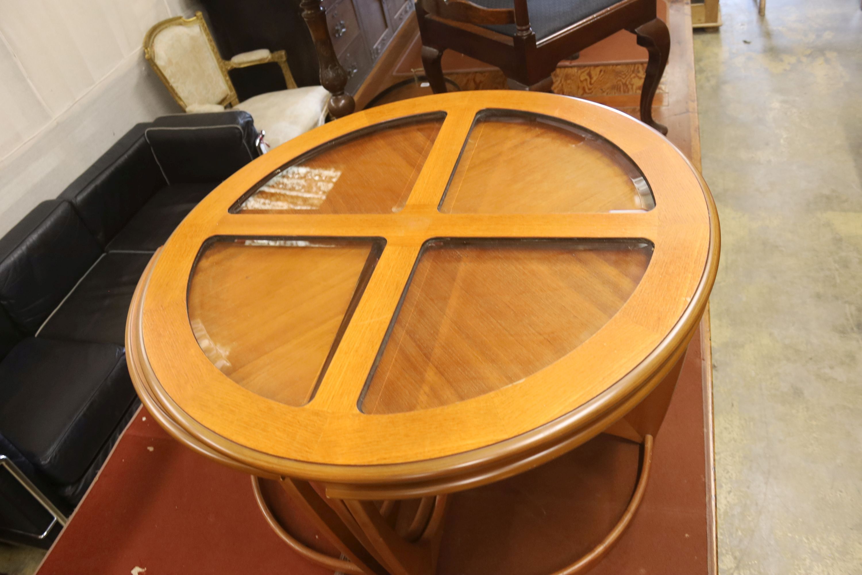 A nest of G plan teak tables, diameter 88cm, height 48cm
